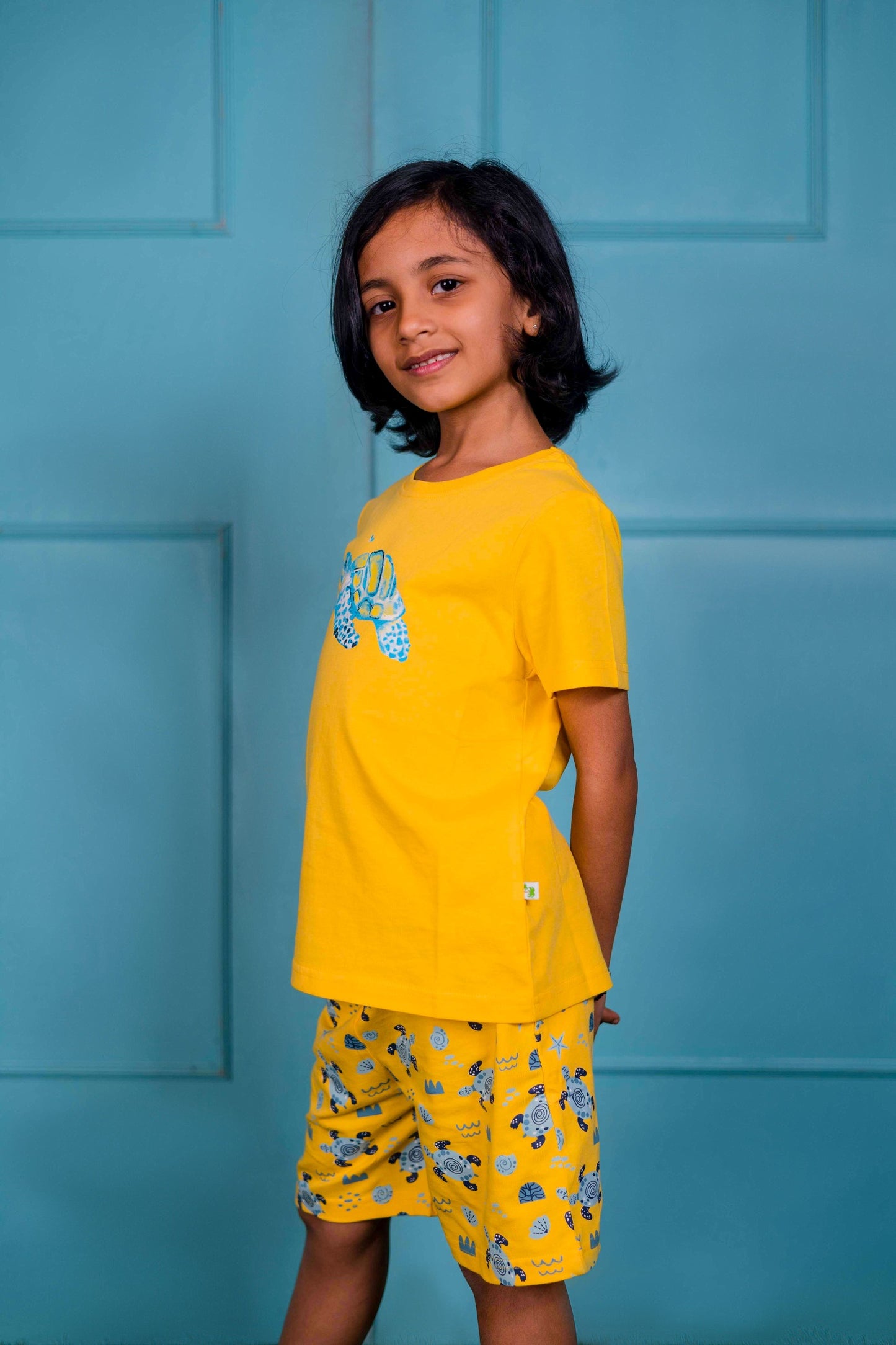 Yellow Turtle Printed T- Shirt with All over print Shorts.